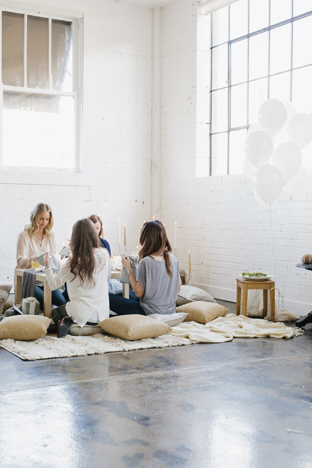women-gathered-around-table-with-balloons-indoors-2026-01-09-09-08-45-utc-2